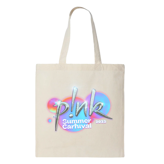 Front view of a white ecru tote bag with silver P!NK text and white 'Summer Carnival 2023' print underneath, set against neon-coloured bubbles.