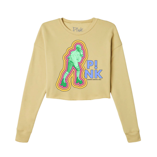 Front view of a mustard cropped fitted long-sleeve T-shirt featuring a green photo of P!NK outlined with yellow, pink, and orange lines, with purple 'P!NK' text to the right.